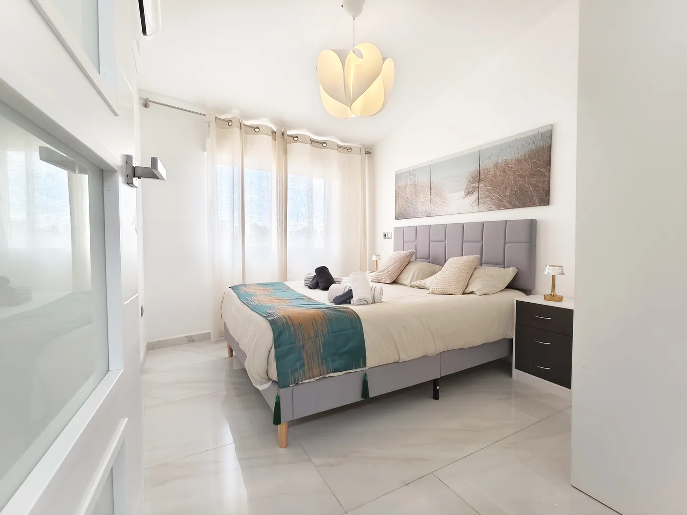 Bright SleekLofts bedroom and living space in Valencia